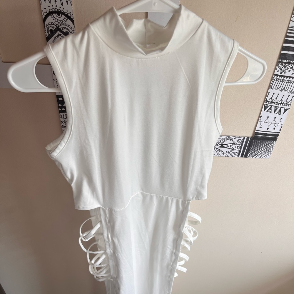 Sexy white body con dress open sides with criss cross straps